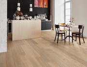 Bauwerk parquet in an open living and dining area.